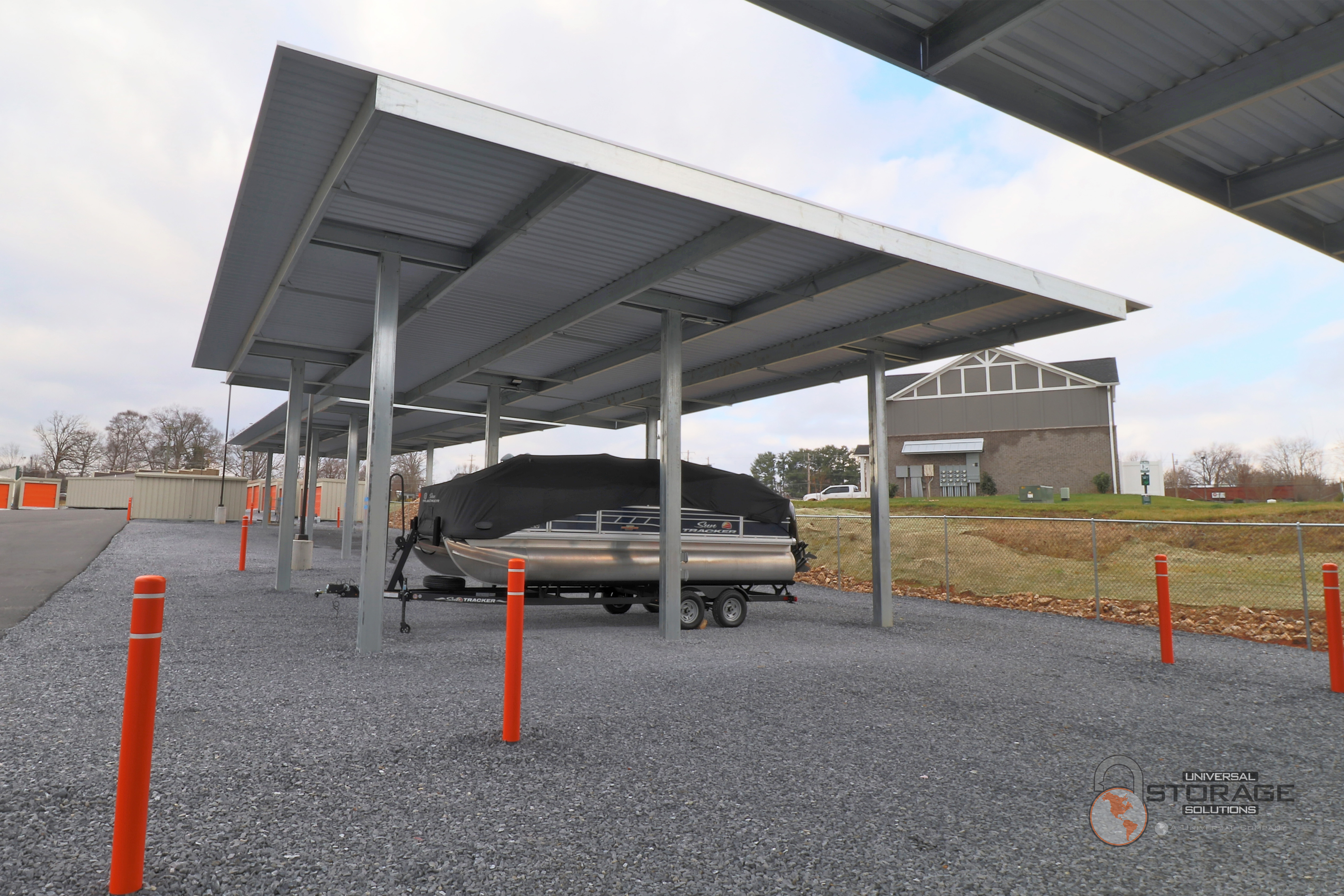 Universal Self Storage Gray covered RV and Boat outdoor parking.